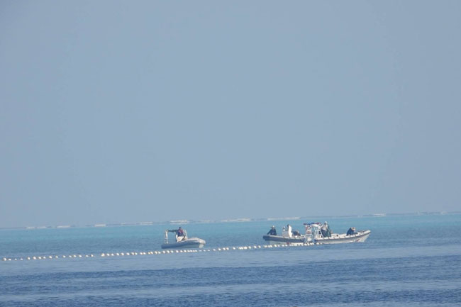 Philippines to remove barrier placed by China in South China Sea - national security advisor